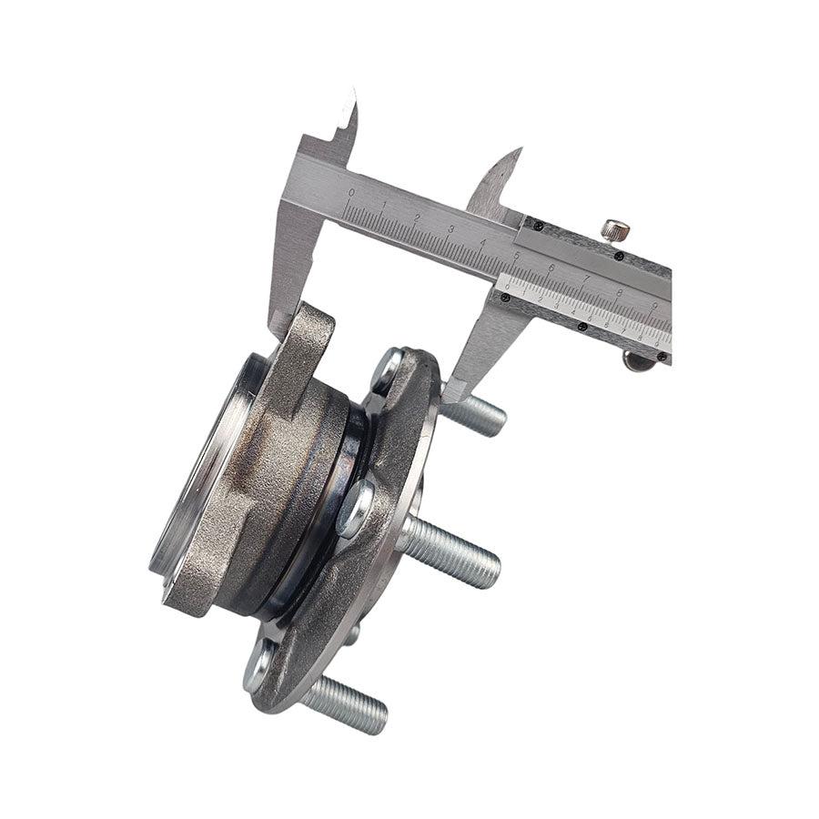 Automotive wheel hub bearing assembly with a passenger car in the background Automotive wheel hub bearing assembly with a passenger car in the background